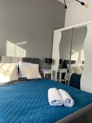 Łóżko lub łóżka w pokoju w obiekcie Apartament Rezydencja Worcella by Apartamenty na dni Wrocław