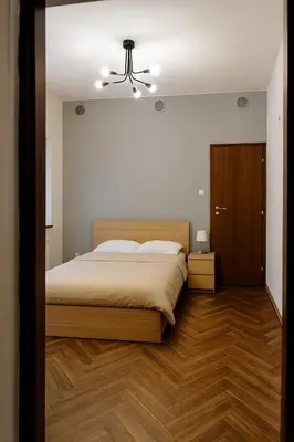 Łóżko lub łóżka w pokoju w obiekcie Stara słodownia