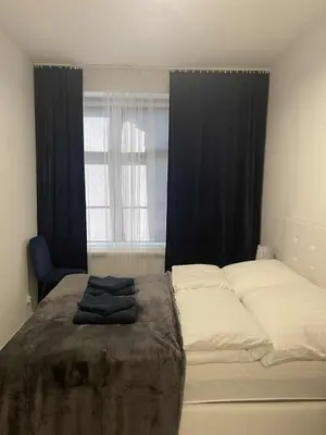 Łóżko lub łóżka w pokoju w obiekcie Apartament 11 Wolności