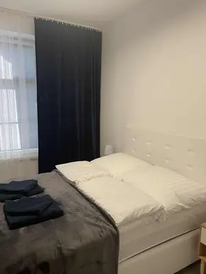 Łóżko lub łóżka w pokoju w obiekcie Apartament 11 Wolności