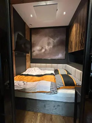 Łóżko lub łóżka w pokoju w obiekcie Central Elegance Apartment