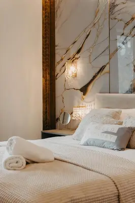 Łóżko lub łóżka w pokoju w obiekcie Witolda - luksusowy apartament w centrum - Fair Rentals