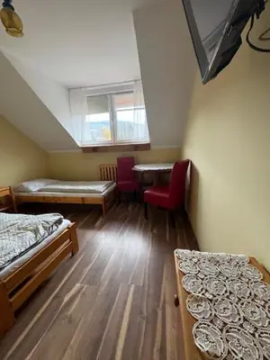 Łóżko lub łóżka w pokoju w obiekcie Zajazd Oleńka