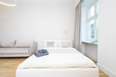 Łóżko lub łóżka w pokoju w obiekcie Central Lux Apartment - Heart of the Old Town Check In 24h