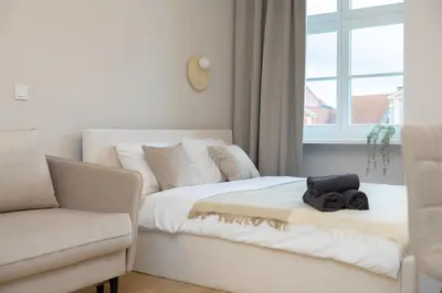 Łóżko lub łóżka w pokoju w obiekcie Central Lux Apartment - Heart of the Old Town Check In 24h