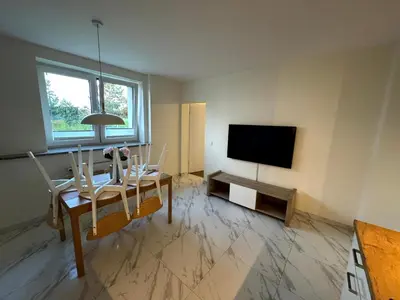 Telewizja i/lub zestaw kina domowego w obiekcie Apartment w domu pod orzechem