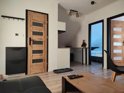 Łóżko lub łóżka w pokoju w obiekcie Apartment pod Sysunia