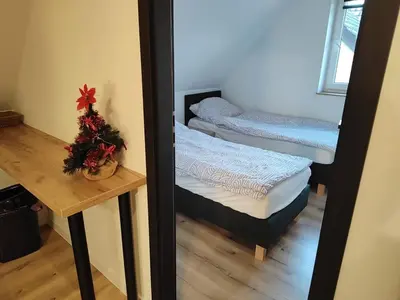 Łóżko lub łóżka w pokoju w obiekcie Apartment pod Sysunia
