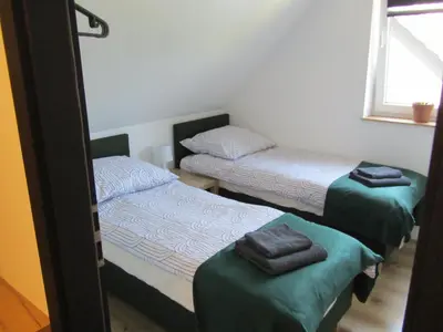 Łóżko lub łóżka w pokoju w obiekcie Apartment pod Sysunia
