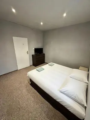 Łóżko lub łóżka w pokoju w obiekcie Hostel przy Żaglach