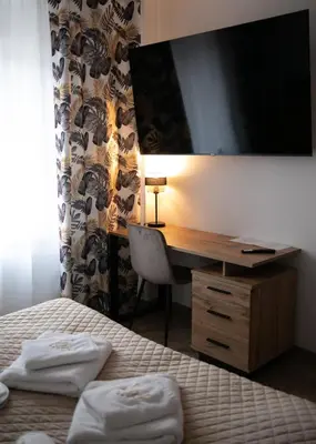 Łóżko lub łóżka w pokoju w obiekcie Hotel Piast