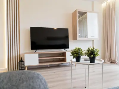 Telewizja i/lub zestaw kina domowego w obiekcie Apartament Palisadowa by Enklawa