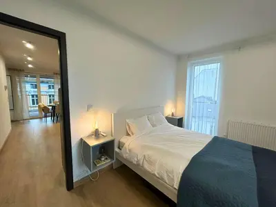 Łóżko lub łóżka w pokoju w obiekcie Apartament przy Rynku z Tarasem i Parkingiem - Blisko PreZero Arena