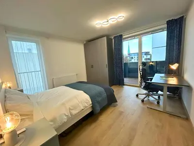 Łóżko lub łóżka w pokoju w obiekcie Apartament przy Rynku z Tarasem i Parkingiem - Blisko PreZero Arena