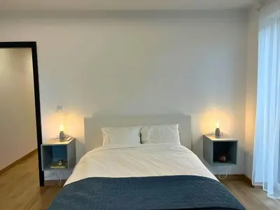 Łóżko lub łóżka w pokoju w obiekcie Apartament przy Rynku z Tarasem i Parkingiem - Blisko PreZero Arena