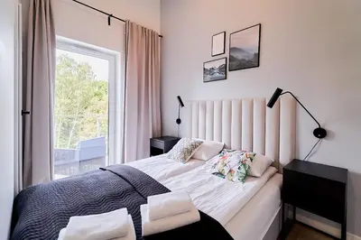 Łóżko lub łóżka w pokoju w obiekcie LAGUNA Apartament Polanica Residence 63-SPA