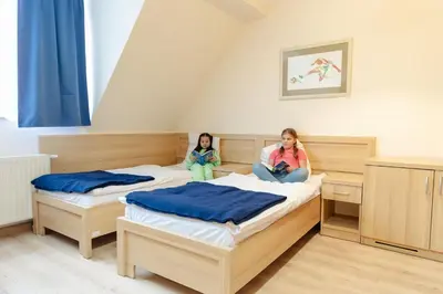 Łóżko lub łóżka w pokoju w obiekcie Jagusia