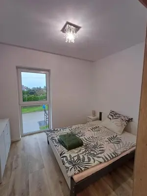 Łóżko lub łóżka w pokoju w obiekcie Mieszkania i Apartamenty