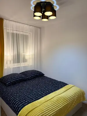 Łóżko lub łóżka w pokoju w obiekcie Apartament OMEGA