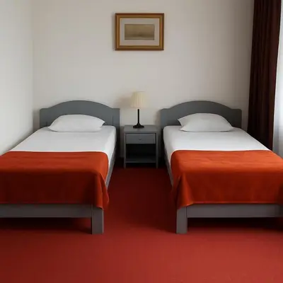 Łóżko lub łóżka w pokoju w obiekcie Hotel Metro