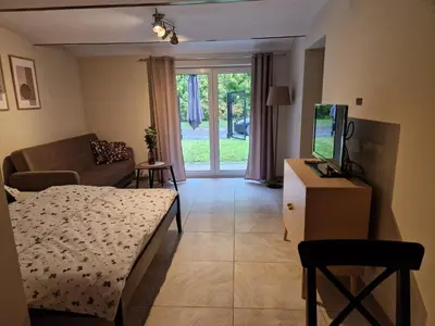 Łóżko lub łóżka w pokoju w obiekcie Leśne Zacisze