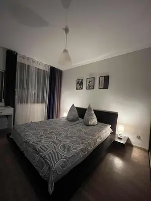 Łóżko lub łóżka w pokoju w obiekcie Apartament Enea z balkonem