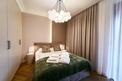 Łóżko lub łóżka w pokoju w obiekcie Polanica Park - LAGUNA - PREMIUM LUX 209