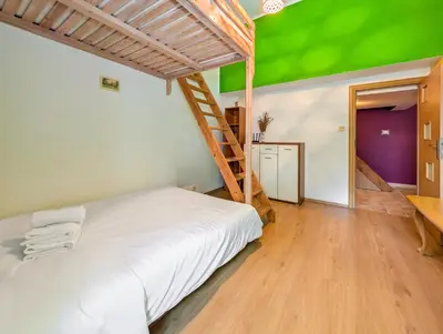 Łóżko lub łóżka w pokoju w obiekcie Podwale Central Apartment by BookingHost