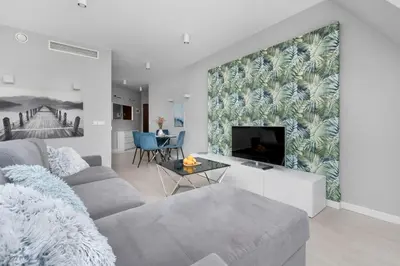Telewizja i/lub zestaw kina domowego w obiekcie Krawiecka Wrocław Sky Loft by Solarento