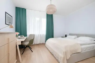 Łóżko lub łóżka w pokoju w obiekcie Azure Apartment Teatralna with Air Conditioning in Wrocław by Noclegi Renters