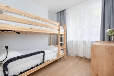 Łóżko lub łóżka w pokoju w obiekcie Azure Apartment Teatralna with Air Conditioning in Wrocław by Noclegi Renters