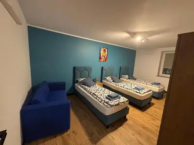 Łóżko lub łóżka w pokoju w obiekcie Nowy Zakątek