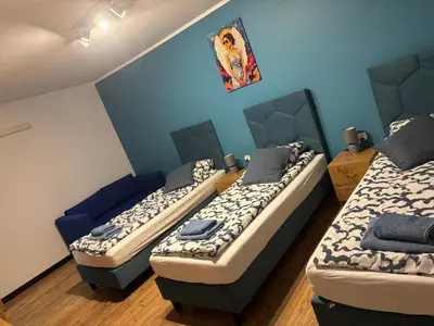 Łóżko lub łóżka w pokoju w obiekcie Nowy Zakątek