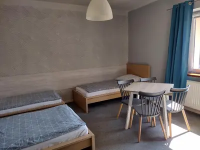 Łóżko lub łóżka w pokoju w obiekcie Agroturystyka Pod Orzechem