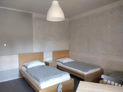 Łóżko lub łóżka w pokoju w obiekcie Agroturystyka Pod Orzechem