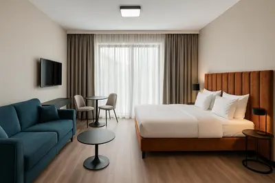 Łóżko lub łóżka w pokoju w obiekcie Aparthotel Opera Wrocław