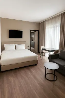 Łóżko lub łóżka w pokoju w obiekcie Aparthotel Opera Wrocław