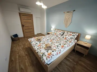 Łóżko lub łóżka w pokoju w obiekcie Karkonoskim Szlakiem