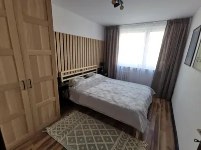 Łóżko lub łóżka w pokoju w obiekcie Apartament Opawska 2