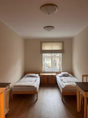 Łóżko lub łóżka w pokoju w obiekcie Apartament w Rynku pod Twierdzą