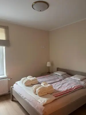 Łóżko lub łóżka w pokoju w obiekcie Apartament w Rynku pod Twierdzą