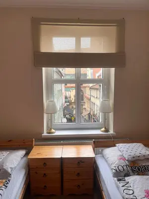 Łóżko lub łóżka w pokoju w obiekcie Apartament w Rynku pod Twierdzą