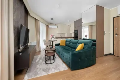 Część wypoczynkowa w obiekcie Stylish Apartment with Air Conditioning and Underground Parking by Noclegi Renters