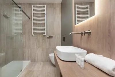 Łazienka w obiekcie Stylish Apartment with Air Conditioning and Underground Parking by Noclegi Renters