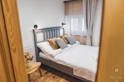 Łóżko lub łóżka w pokoju w obiekcie Apartamenty For You