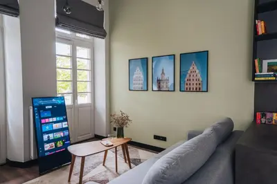 Telewizja i/lub zestaw kina domowego w obiekcie WroclawGuide Riverview Old Town Apartment - Gemütliche Wohnung mit Flussblick in bester Lage