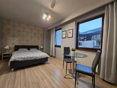 Łóżko lub łóżka w pokoju w obiekcie Happy Estate - ul Krawiecka 1