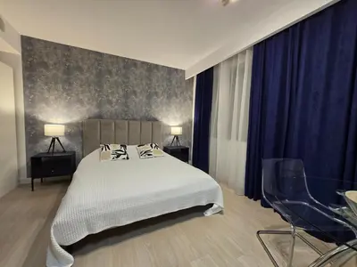 Łóżko lub łóżka w pokoju w obiekcie Happy Estate - ul Krawiecka 1