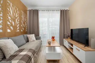 Telewizja i/lub zestaw kina domowego w obiekcie Cosy Studio in Wrocław Near the River with Parking and Balcony by Noclegi Renters