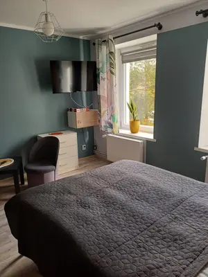 Łóżko lub łóżka w pokoju w obiekcie Jelonkowo